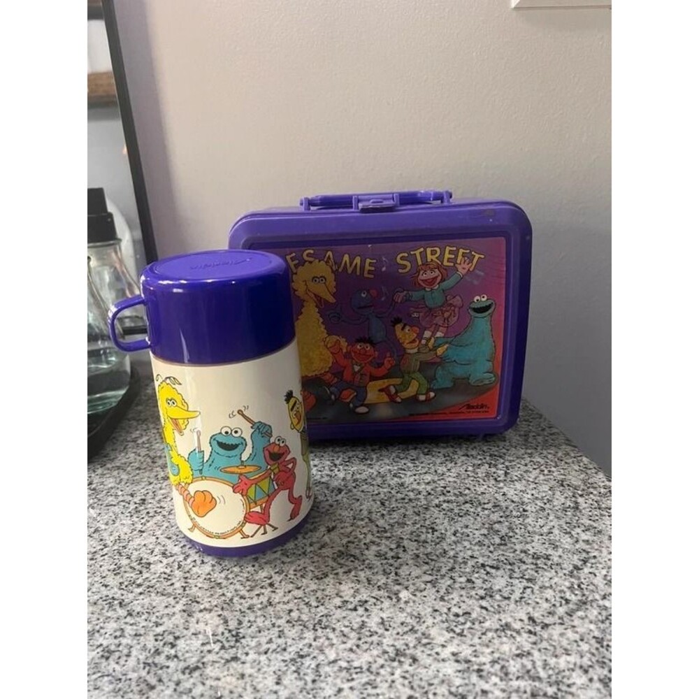 Vintage Sesame Street lunch box with thermos